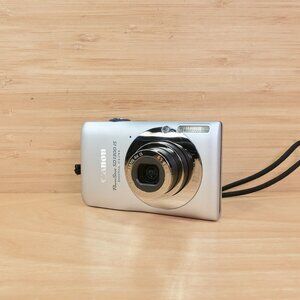 Share Canon PowerShot SD1300 IS Digital ELPH 12.1MP / Silver / Tested V